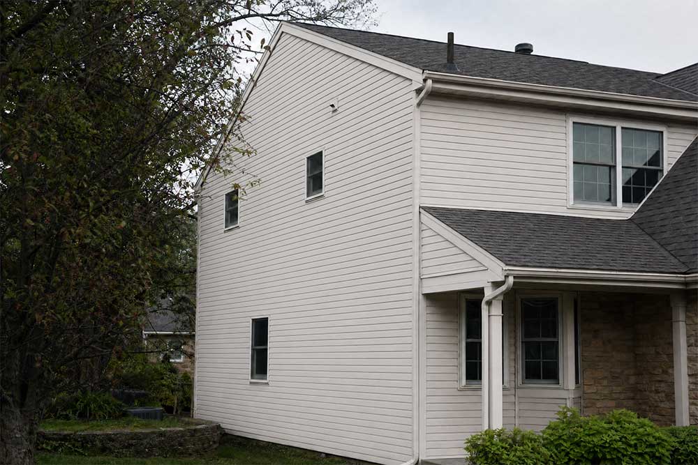 Two-story residential house in Neenah, Wisconsin, showing exterior after professional house washing and power washing services.